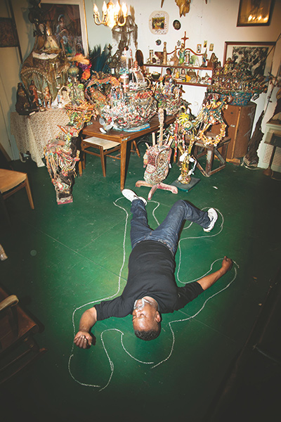 HANGING ON: Retired cop Kevin Sampson works in a window factory when he's not in his Newark studio. Photo by Buck Ennis.